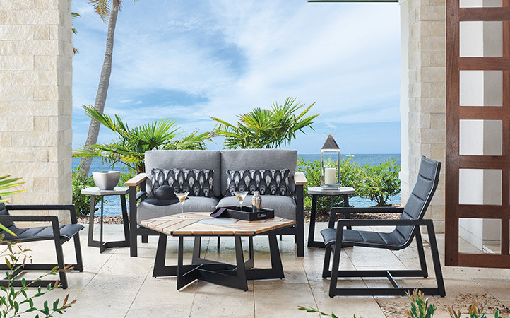 South Beach outdoor living scene featuring sofa and cocktail table.