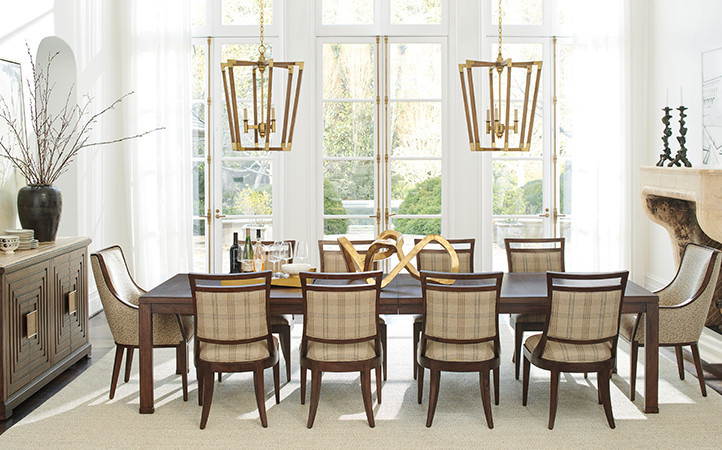 Silverado dining room features a buffet, long dining table with ten upholstered dining chairs.