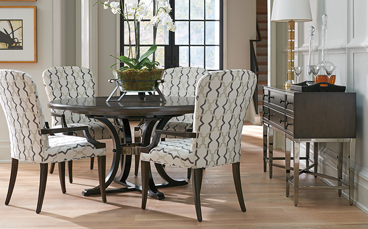 Dining room scene featuring dining table with four armless dining chairs.