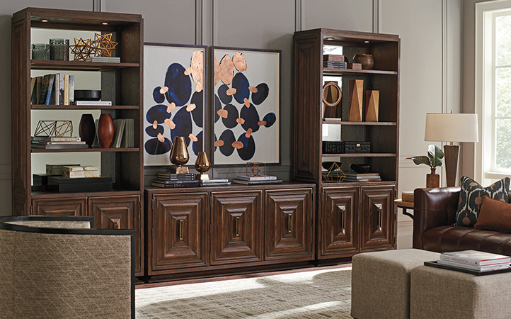 Brown media console and two brown bookcases