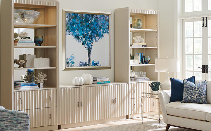 One Ivory Media Console In Between Two Ivory Bookcases