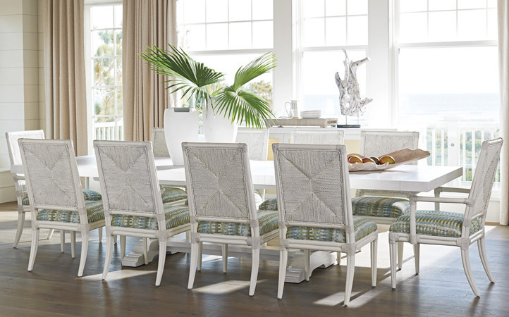 Ocean Breeze dining room features a large dining table with ten chairs with multi-color upholstered seats.
