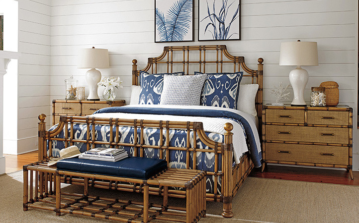 Twin Palms bedroom features a rattan king bed, two nightstands, and a rattan bench.