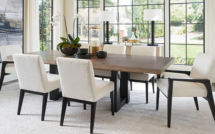 The Wellesley dining table extends to 124 inches with the two 20-inch leaves, The trestle base features a striking asymmetrical design in the Tunis finish, complimented by a thick apron on the table top in the Senegal finish. From a design perspective, th