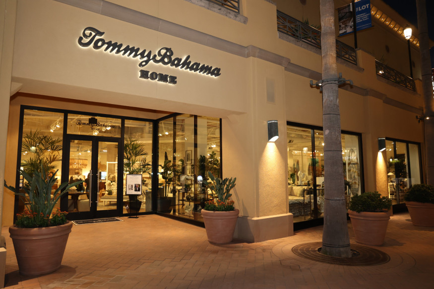 Outdoor fascia with palm trees and Tommy Bahama Home logo over the store entrance.