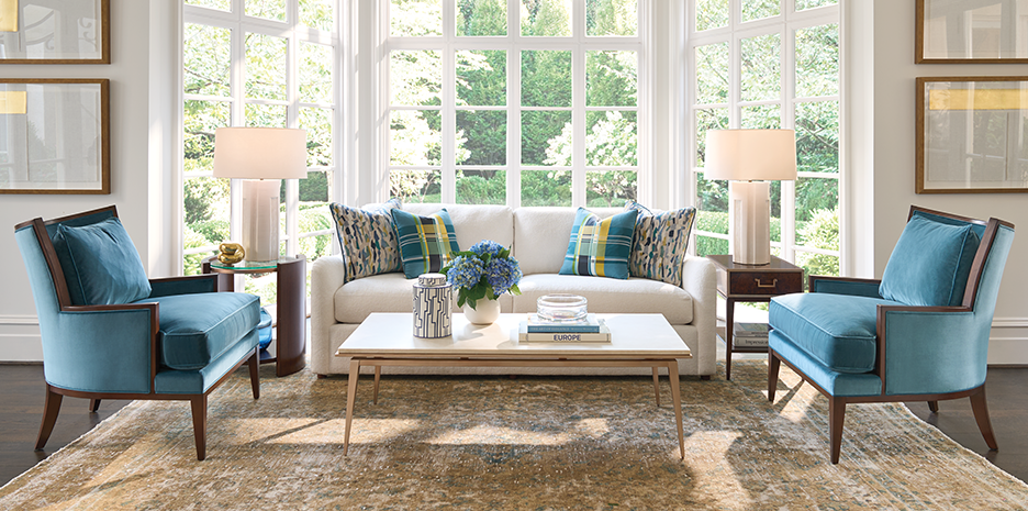 Rendezvous living room scene featuring two Atwood chairs, a Bulgari rectangle cocktail table, a Lennox round accent table, and a Shelton box on stand end table.